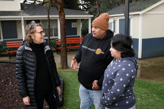 Amy Davidson visits with clients