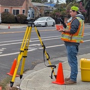 Surveying Technician Spencer Oyama uses a total station