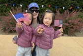 Toddlers waving flags