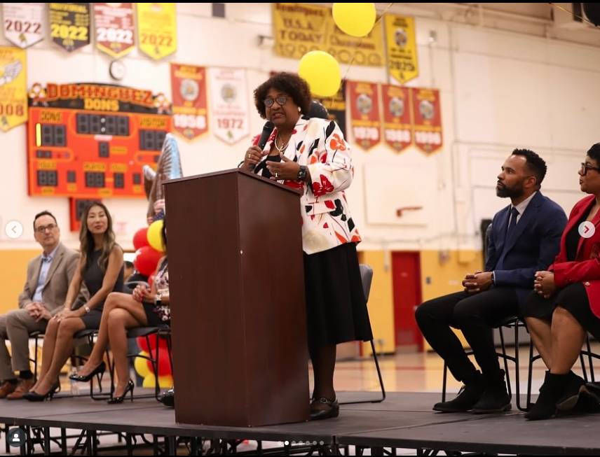Secretary Weber on stage visiting high schools in Los Angeles County 