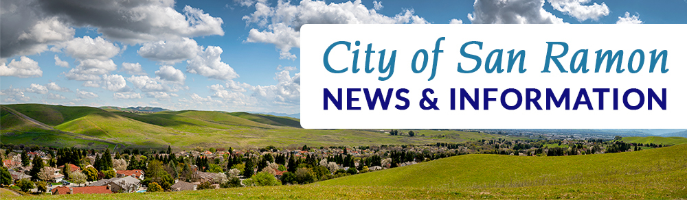 Photo of houses surrounded by green hills with blue skies. Text reads "City of San Ramon News and Information."