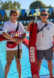 Lifeguards standing at pool deck