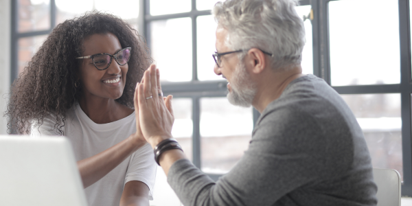 Tutor and learner sharing a high five