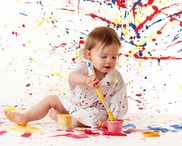 baby playing with paint