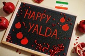 Sign reading "Happy Yalda"