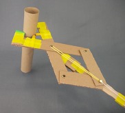 articulated grabber made from cardboard and other craft materials