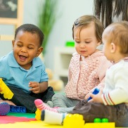 three babies playing together