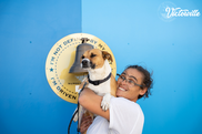 Teresa Massie, the 200th graduate of the Victorville Wellness Center holds her dog, Cyndi Marie Lauper