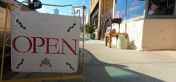 open sign in sidewalk in Isleton