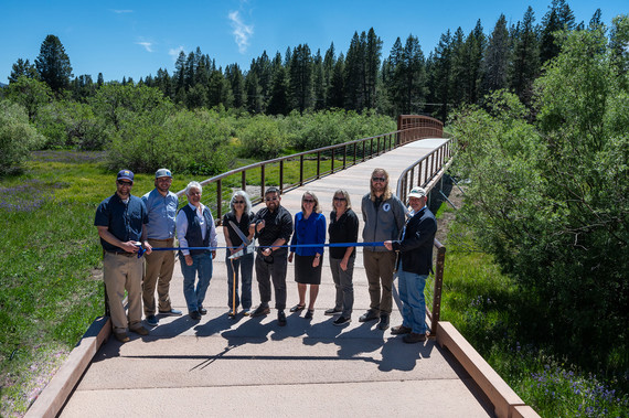 People cutting the ribbon on a new shared-used trail