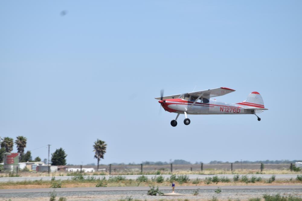 Photo of small plane landing or taking off an airport runway