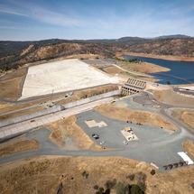 An aerial view of crews performing maintenance work on Oroville Dam's main spillway. 