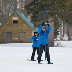 Members of DWR's Snow Surveys and Water Supply Forecasting Unit perform snowpack measurements at Phillips Station on Feb. 29. 
