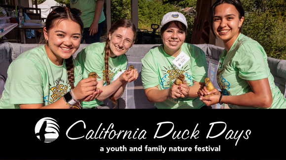 Four young women holding ducklings at California Duck Days 