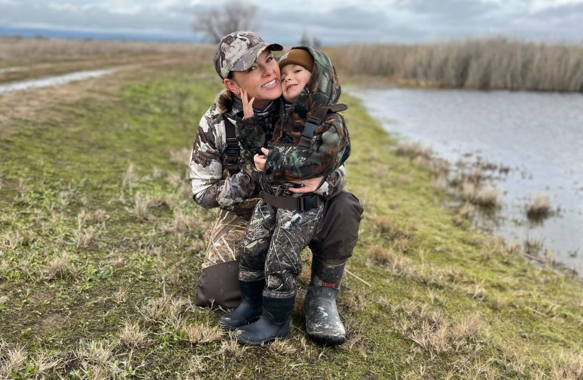 Mom and child in field for hunt