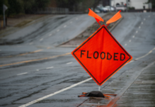 Photograph of sign warning of flooded street