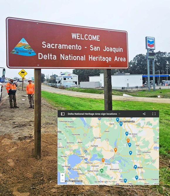 Photo of a newly installed road sign with a map inset 