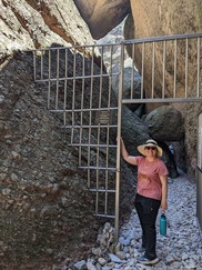 Megan Giglini posing at a mountain