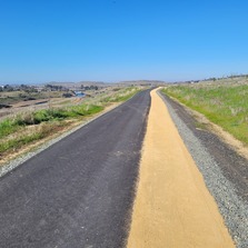 The Brad Freeman trail near Cherokee Rd. features an asphalt path and a decomposed granite pedestrian path. 
