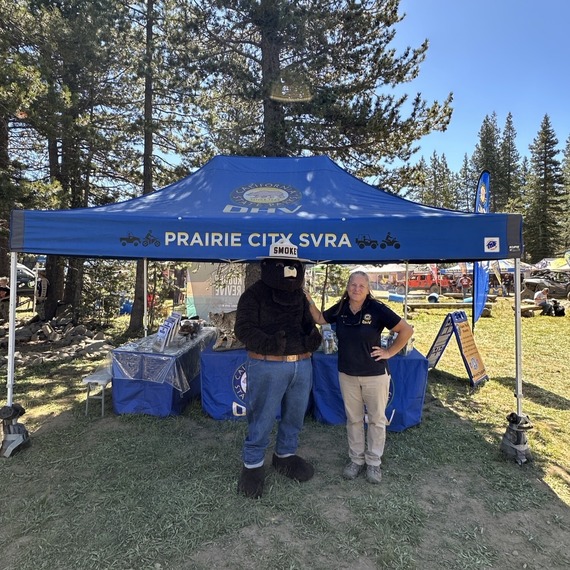 Tahoe National Forest  State Park Interpreter I Joleen Ossello and Smokey Bear pose the Cal4Wheel Sierra Trek event at Meadow Lake near Truckee.