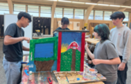 Students painting little library