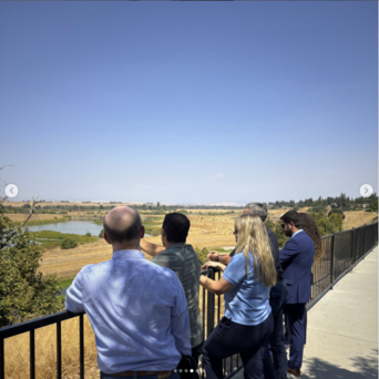 Instagram Screenshot of Secretary Crowfoot and partners overlooking future River West site