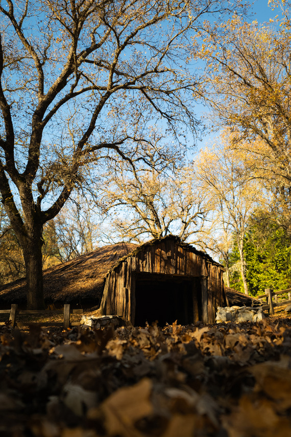 Indian Grinding Rock SHP_autumn leaves in front of Chaw Se' Roundhouse