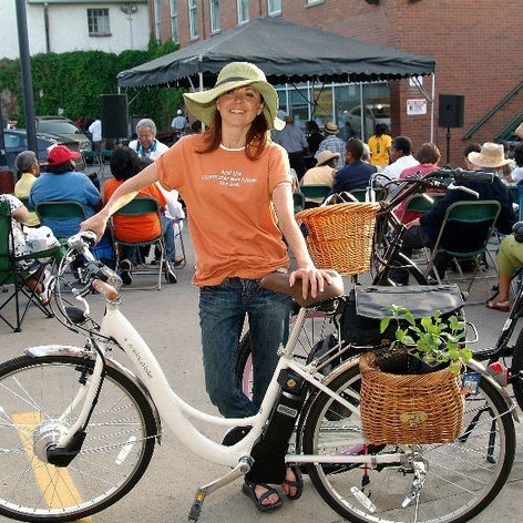 Woman next to her e-bike