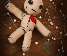 Doll with pins in it