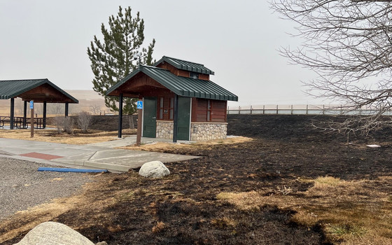 Burned grass, shelter and restroom intact at Coalton Trailhead