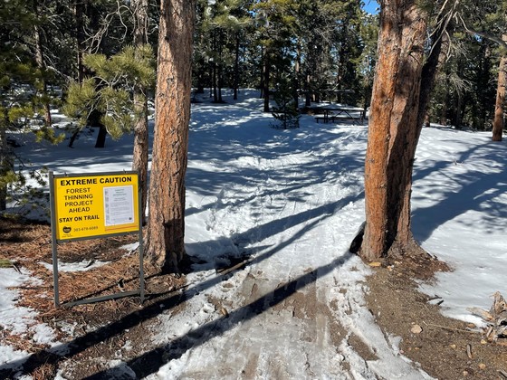 Caution trail sign at Caribou Ranch trailhead