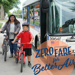 Boy and woman standing with their bikes waiting to board the bus, logo for Zero Fare for Better Air August in the corner.