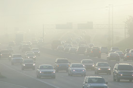 Rush hour traffic with smog.