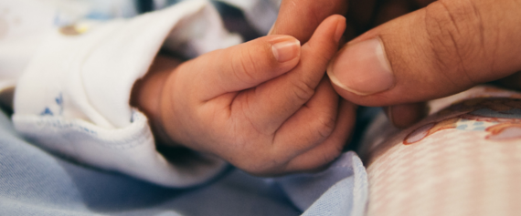 Mom holding newborn baby