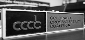 Picture of a Colorado Cross Disability Coalition Sign in Black and White