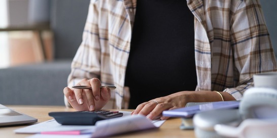 woman working with calculator