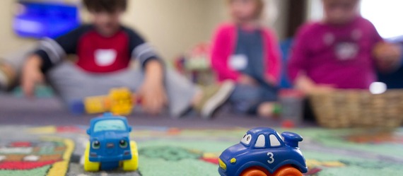 Blurred faces of children of a preschool 