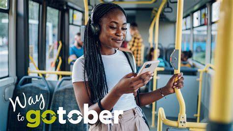 GoTober logo with woman riding the bus listening to music
