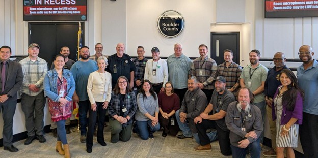 Boulder County Commissioners and Boulder County staff in the Commissioners' Hearing Room in Boulder.