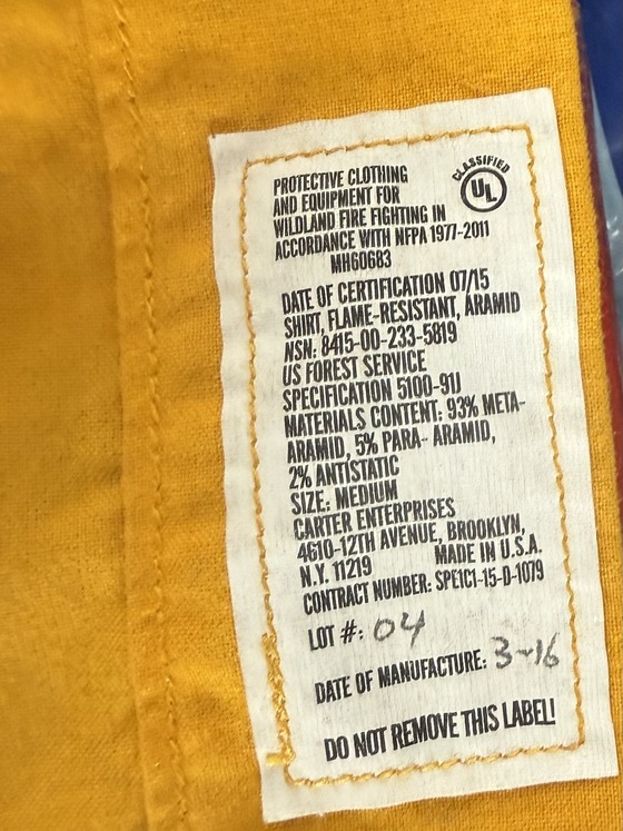 Label inside a firefighter's bunker gear showing expiration date