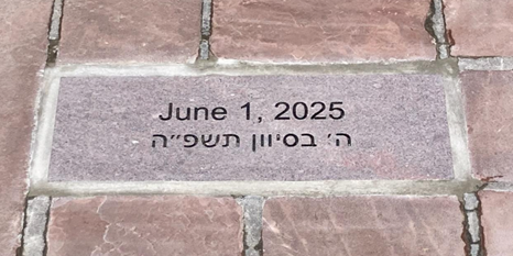 Stone marker on the Boulder County Courthouse bricks remembering the attack on 29 community members on June 1, 2025