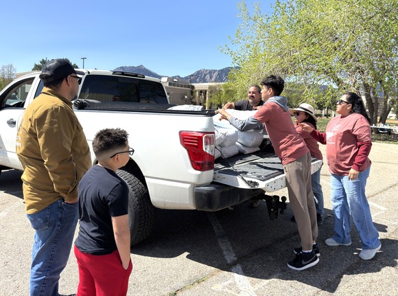 Climate Equity Fund project participants pick up soil from 2025 grant recipient, Growing Gardens