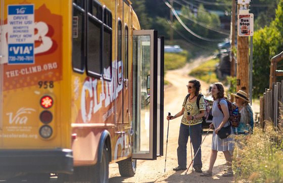 The Climb bus at a bus stop in Gold Hill