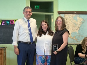 Camerron, Maria, and Director Lunn pose for a picture at the Employee of the Year event