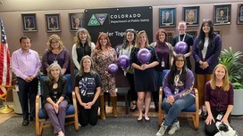 OVP Staff wearing purple pose for a picture 