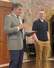 Alyssa receiving Innovation Award from Director Lunn