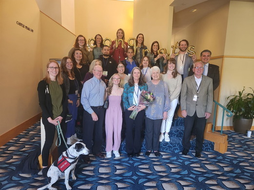 Photo of Kelly with family and members of OVP