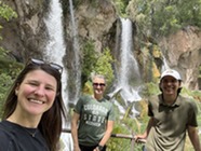Photo of DCW Employees in front of Rifle Falls State Park waterfall