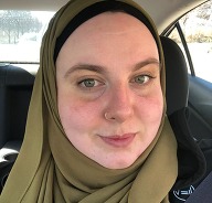 Headshot of Sarah Hanselin wearing an olive-green hijab