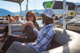 Women drinking wine on a boat